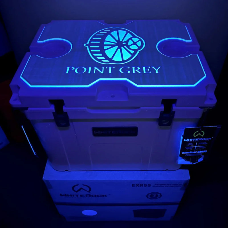 Load image into Gallery viewer, WhiteRock EXR55 cooler box with glowing Point Grey logo under neon blue light

