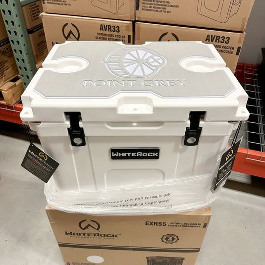 WhitePoint Grey cooler with embossed logo on lid, placed on WhiteRock box in warehouse