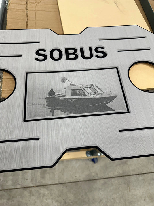 Sobus boat accessory panel with engraved small fishing boat image and name SOBUS