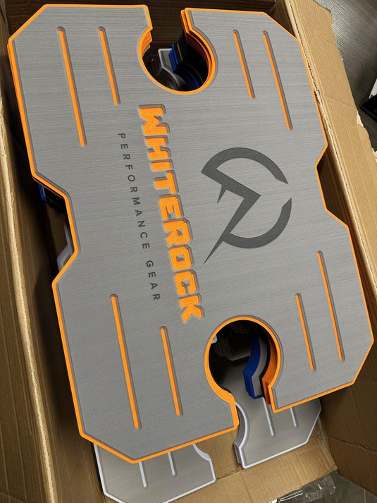 WhiteRock Performance Gear gray and orange rubber sample pad in a cardboard box
