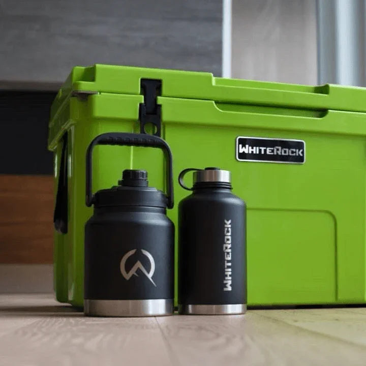Load image into Gallery viewer, Black WhiteRock insulated water bottles and bright green WhiteRock cooler box on wooden floor
