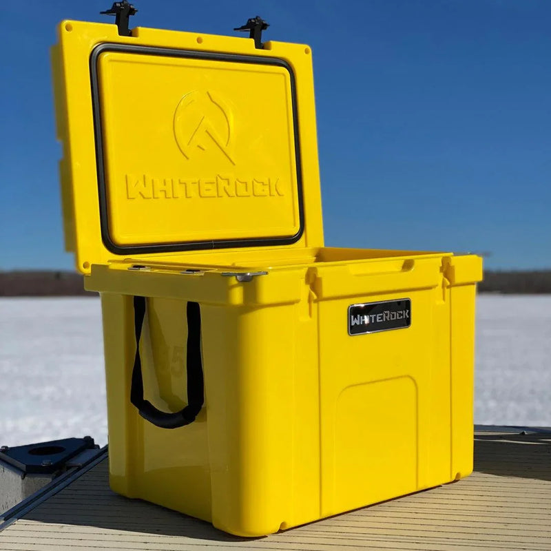 Load image into Gallery viewer, Yellow WHITEROCK cooler with open lid on dock by snowy lake under clear blue sky
