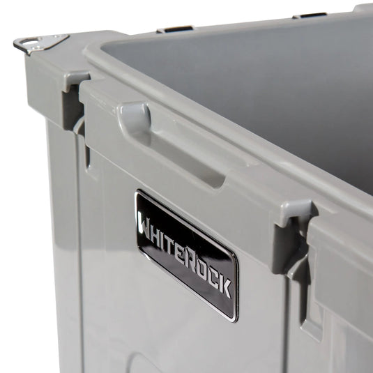 Close-up of gray WhiteRock storage container with black and white brand label