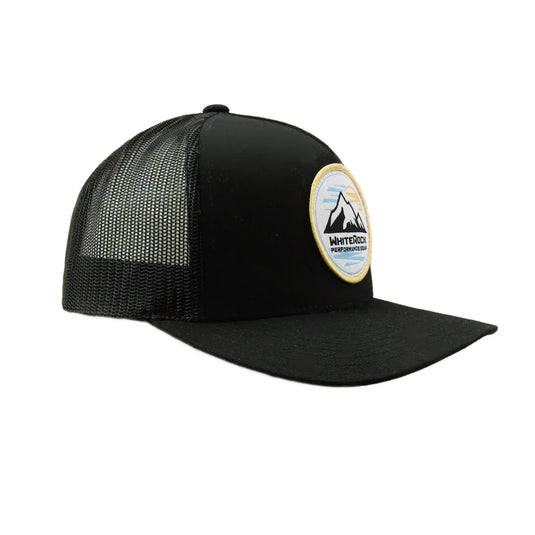 Black mesh trucker hat with mountain patch and White Rock Performance Gear logo