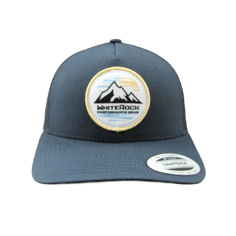 Load image into Gallery viewer, Blue snapback cap with WhiteRock Performance Gear mountain logo patch and sticker
