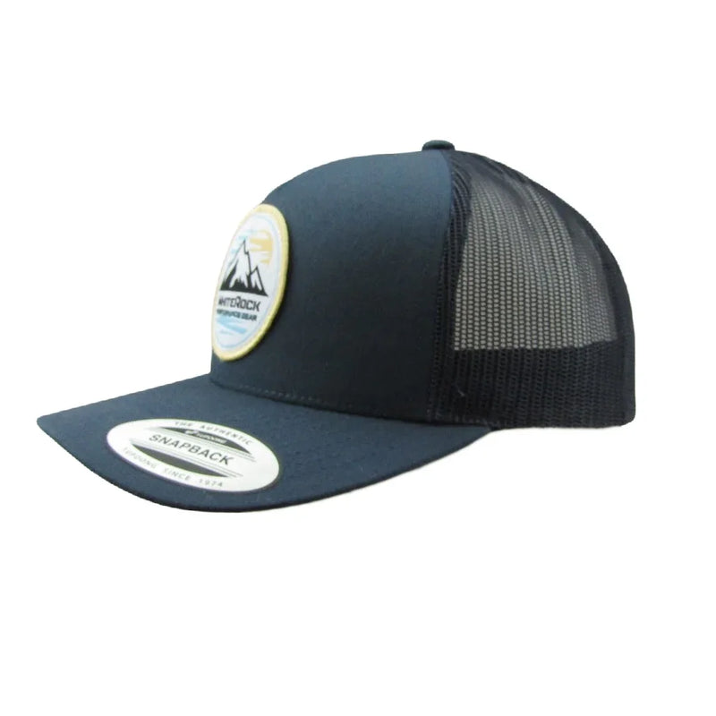 Load image into Gallery viewer, Blue and black mesh snapback hat with mountain logo patch and flat brim
